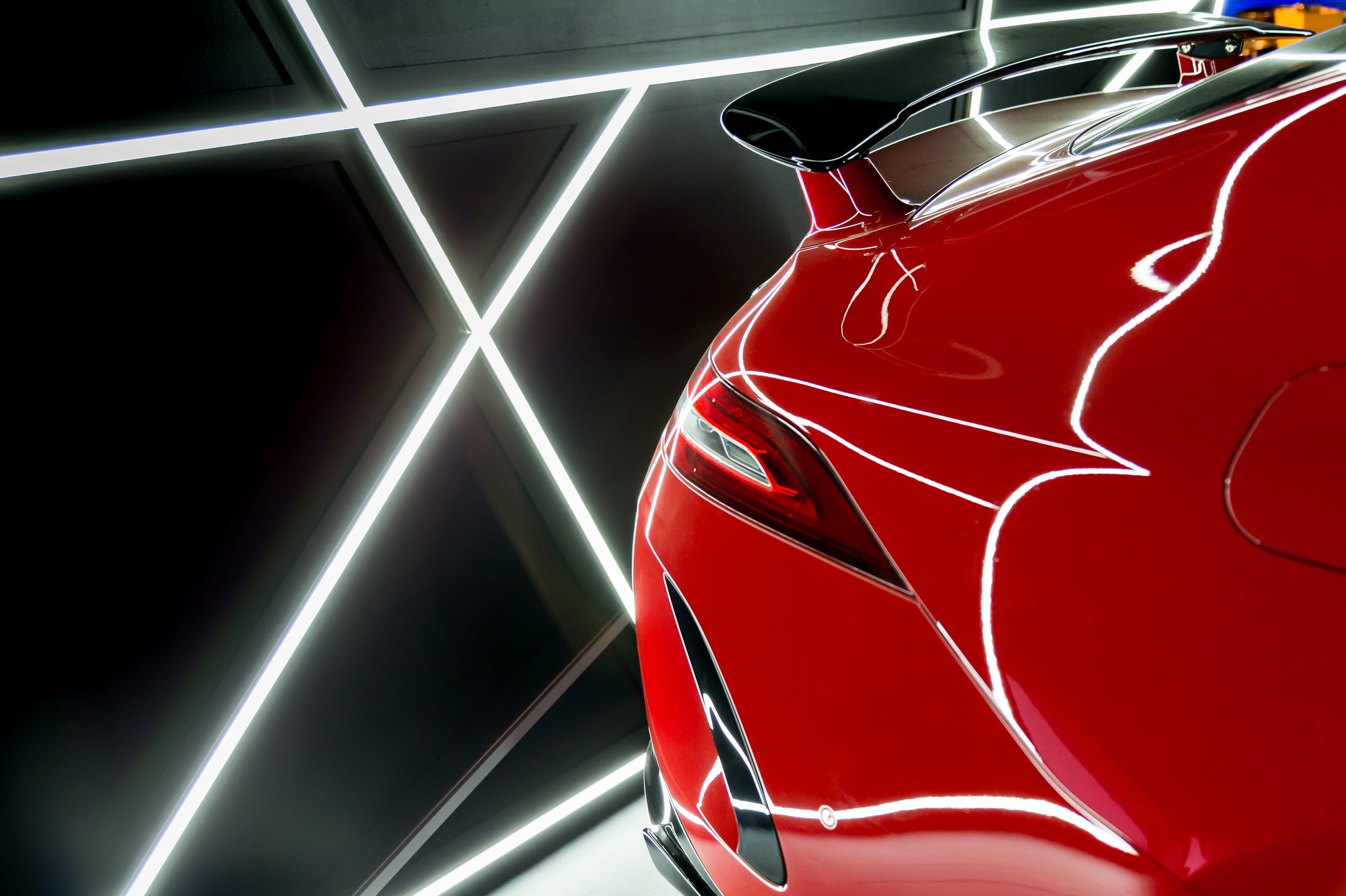 luxury-red-car-closeup-details-with-reflections-of-neon-lights-in-it.jpg